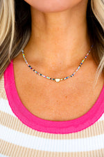 Tiny Gold Heartbeat Necklace