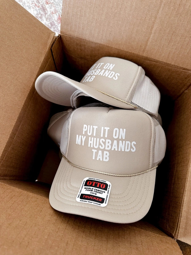 Put It On My Husband's Tab Trucker Hat-Beige